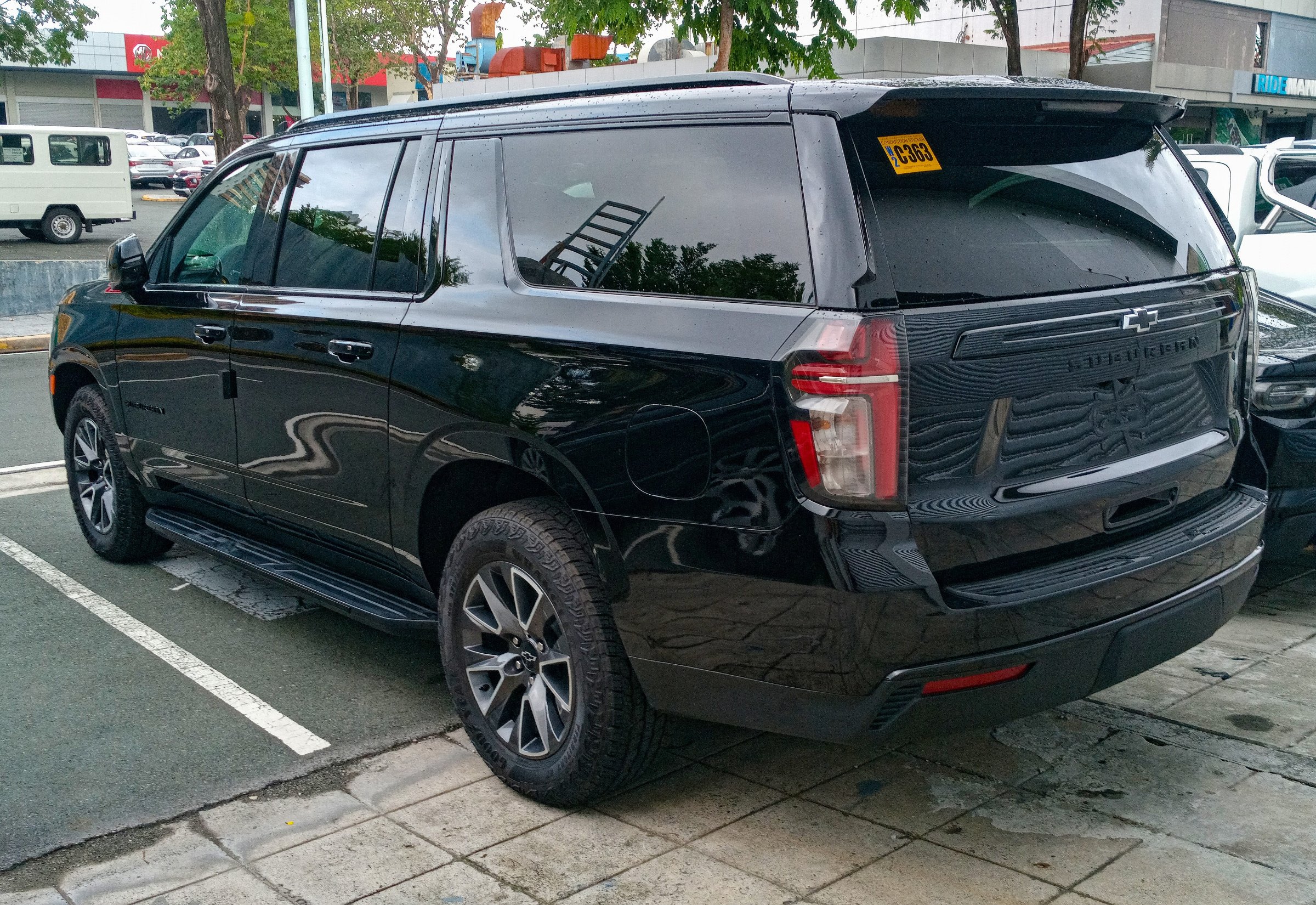 Black 2024 Chevrolet Suburban Z71, rear three-quarter view